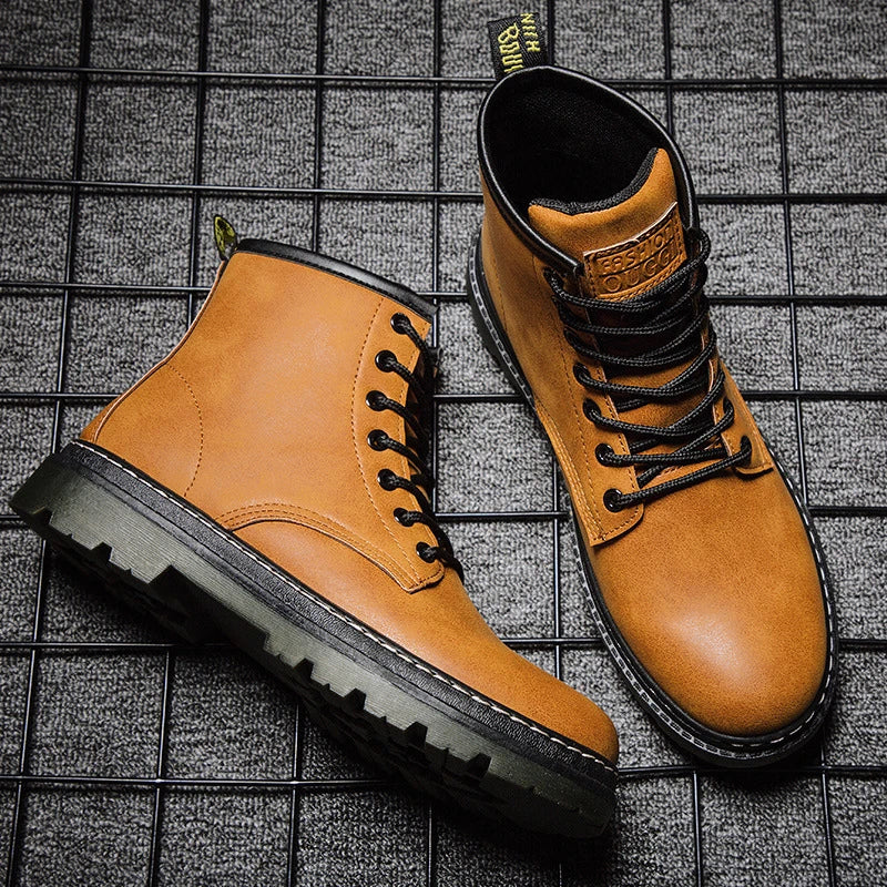 A pair of black leather cowboy boots with a high-cut design and classic western-inspired stitching