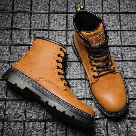 A pair of black leather cowboy boots with a high-cut design and classic western-inspired stitching