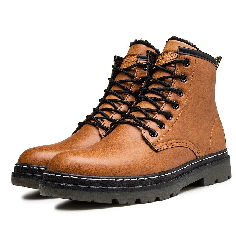 A pair of black leather cowboy boots with a high-cut design and classic western-inspired stitching