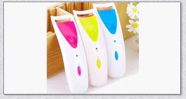 Heated Electric Eyelash Curler with three color options - blue, yellow, and pink. Compact and portable design for effortless lash curling on the go.