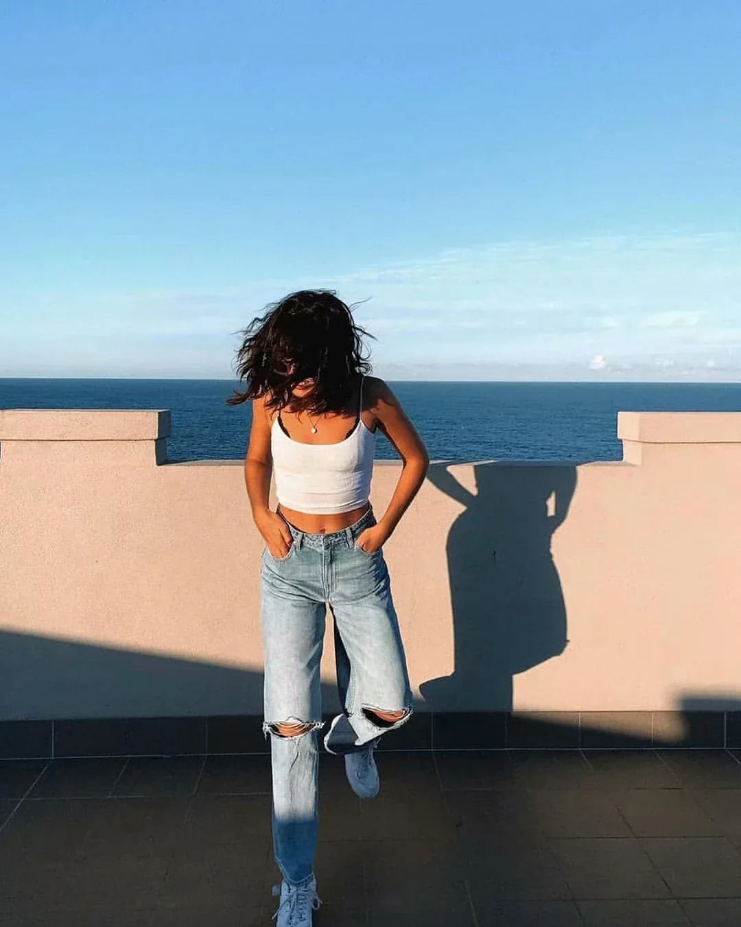 Premium cotton denim jeans with double-knee design and rolled edge detail for enhanced durability and modern style