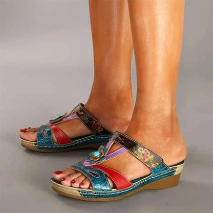 Stylish and comfortable ethnic-inspired wedge slippers with a fish mouth design, available in various colors.