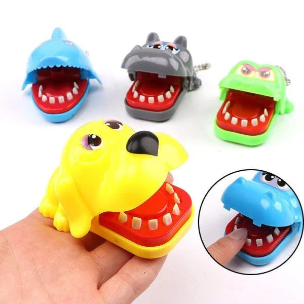 A realistic-looking shark-shaped biting finger toy that provides a satisfying snap when pressed down on.