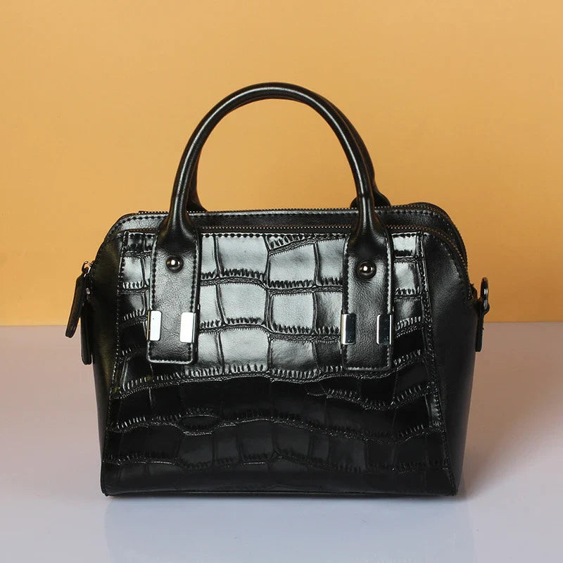 A stylish and functional cowhide leather women's shoulder bag with a unique crocodile pattern design
