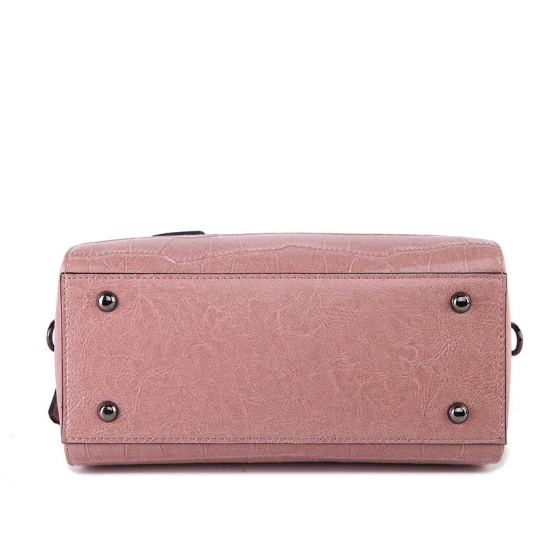 A stylish and functional cowhide leather women's shoulder bag with a unique crocodile pattern design