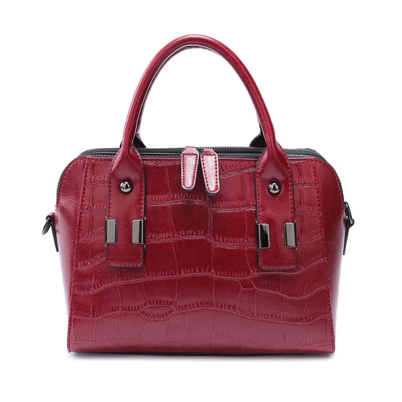 A stylish and functional cowhide leather women's shoulder bag with a unique crocodile pattern design