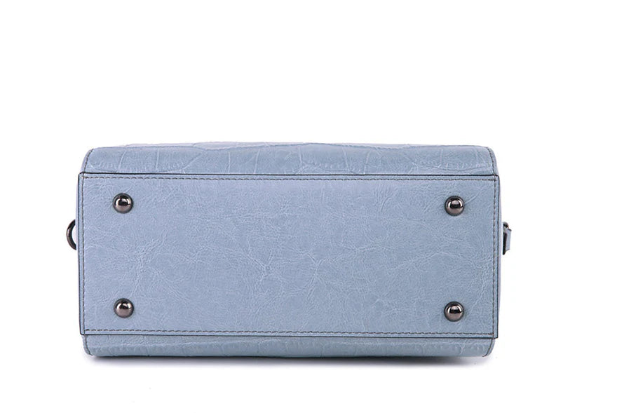 A stylish and functional cowhide leather women's shoulder bag with a unique crocodile pattern design