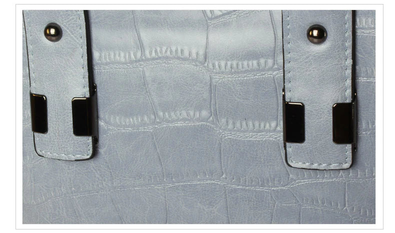 A stylish and functional cowhide leather women's shoulder bag with a unique crocodile pattern design