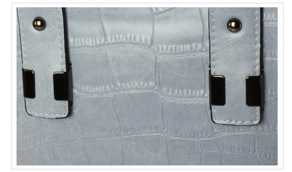 A stylish and functional cowhide leather women's shoulder bag with a unique crocodile pattern design