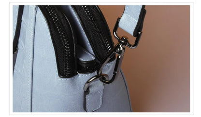 A stylish and functional cowhide leather women's shoulder bag with a unique crocodile pattern design