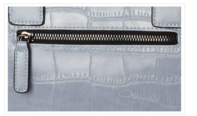 A stylish and functional cowhide leather women's shoulder bag with a unique crocodile pattern design