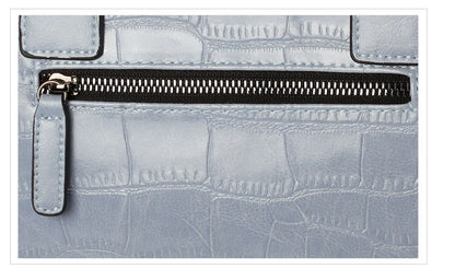 A stylish and functional cowhide leather women's shoulder bag with a unique crocodile pattern design