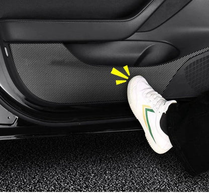 4 Pieces of Carbon Fiber Car Door Anti-Kick Pads Protecting a Tesla Model 3