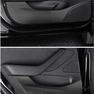 4 Pieces of Carbon Fiber Car Door Anti-Kick Pads Protecting a Tesla Model 3