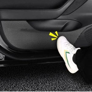 4 Pieces of Carbon Fiber Car Door Anti-Kick Pads Protecting a Tesla Model 3