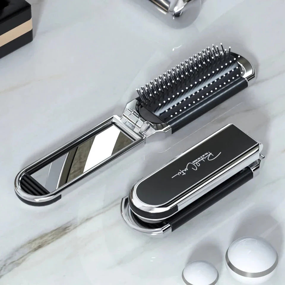 A portable, foldable hair brush with a built-in mirror for on-the-go grooming and touch-ups