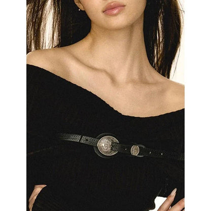 A beautiful, off-the-shoulder sweater with a slim fit and a stylish belt decoration
