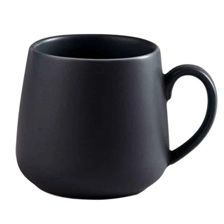 A modern, matte-textured ceramic coffee mug in a variety of colors, with a comfortable handle and generous 10.82 oz capacity.