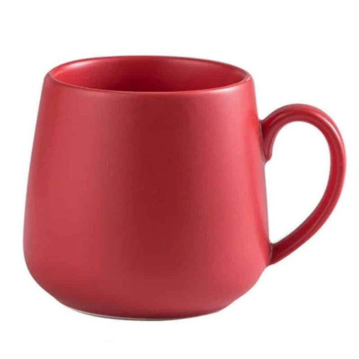 A modern, matte-textured ceramic coffee mug in a variety of colors, with a comfortable handle and generous 10.82 oz capacity.