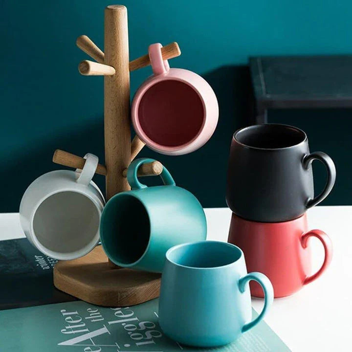 A modern, matte-textured ceramic coffee mug in a variety of colors, with a comfortable handle and generous 10.82 oz capacity.