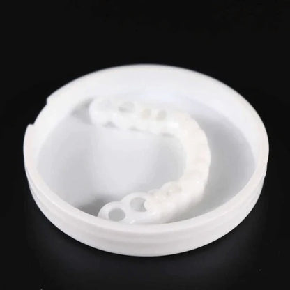 A close-up view of a set of snap-on dentures with a natural-looking appearance, designed to transform your smile instantly.