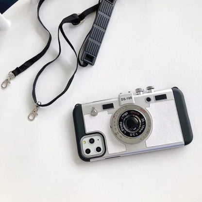 Retro-inspired shatterproof phone case with camera-style design, available in black, brown, and gray colors for iPhone 12/13 models.