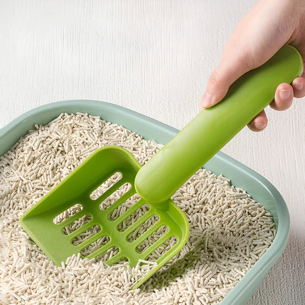 Plastic cat litter scoop with self-cleaning base for efficient and hassle-free litter box cleaning
