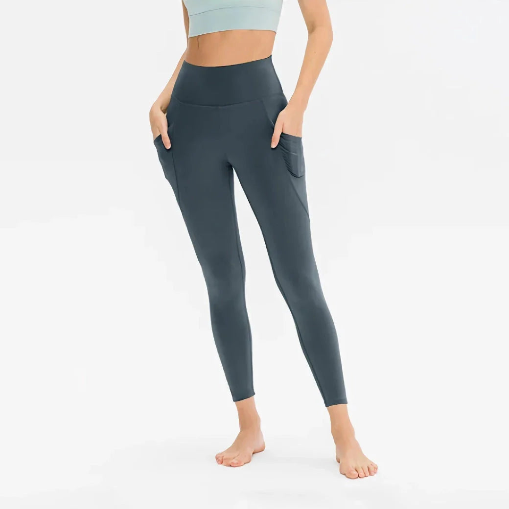 High-waist yoga leggings for women with pockets, made from a stretch fabric blend for comfort and support during workouts and everyday wear.