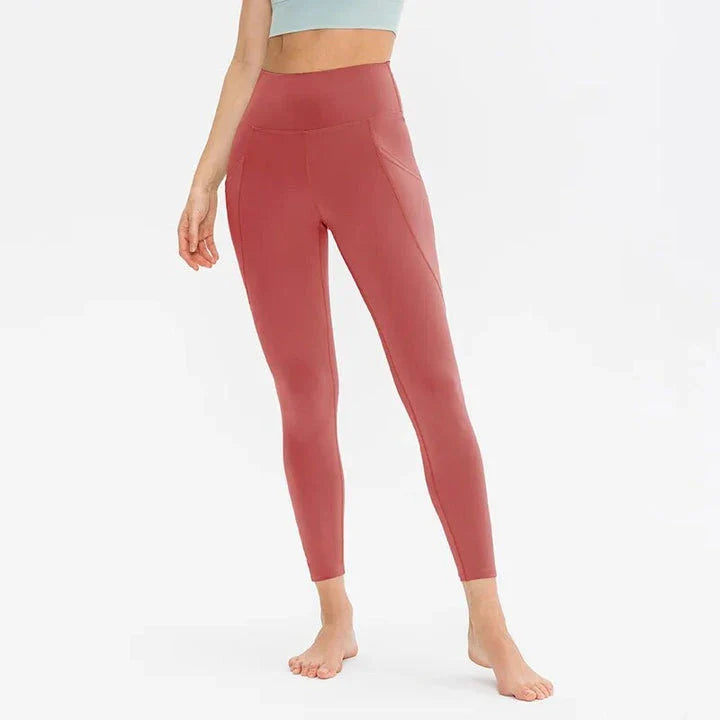 High-waist yoga leggings for women with pockets, made from a stretch fabric blend for comfort and support during workouts and everyday wear.
