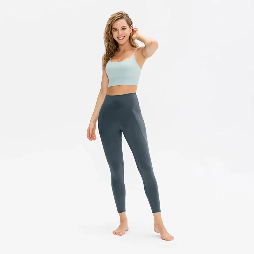 High-waist yoga leggings for women with pockets, made from a stretch fabric blend for comfort and support during workouts and everyday wear.