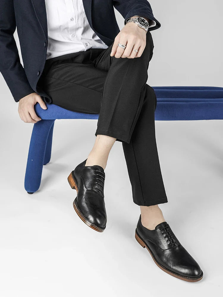 Men's low-top business dress shoes in a polished British retro style, crafted from high-quality cowhide for lasting comfort and sophistication.