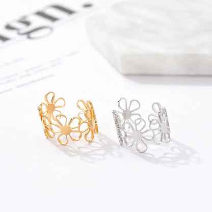 Elegant stainless steel adjustable ring with a charming daisy flower pattern, perfect for daily wear or special occasions.