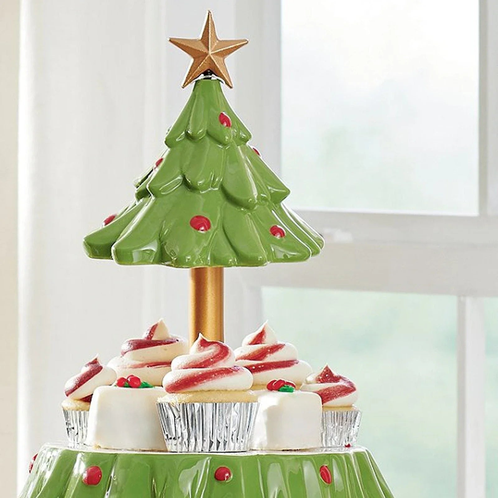 A two-tier Christmas tree-shaped dessert stand made of high-quality materials, perfect for displaying a variety of holiday treats.
