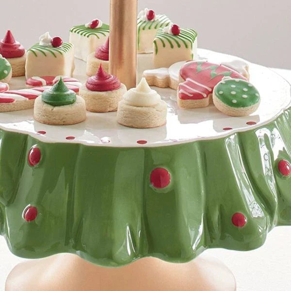 A two-tier Christmas tree-shaped dessert stand made of high-quality materials, perfect for displaying a variety of holiday treats.