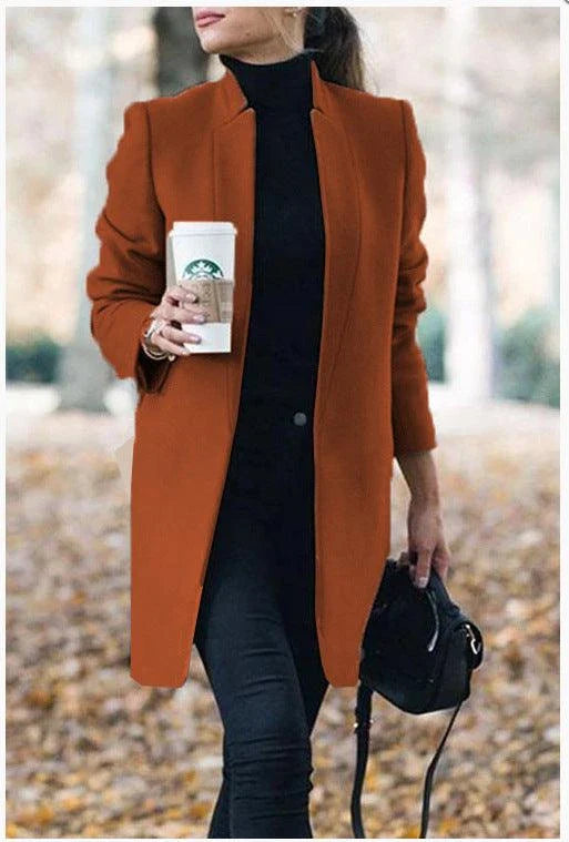 Fashionable solid color woolen coat with a stand collar, designed for warmth and style during the winter season.