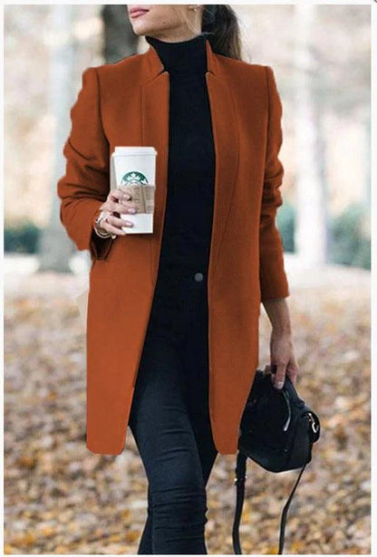 Fashionable solid color woolen coat with a stand collar, designed for warmth and style during the winter season.