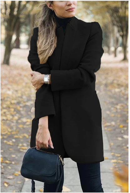 Fashionable solid color woolen coat with a stand collar, designed for warmth and style during the winter season.