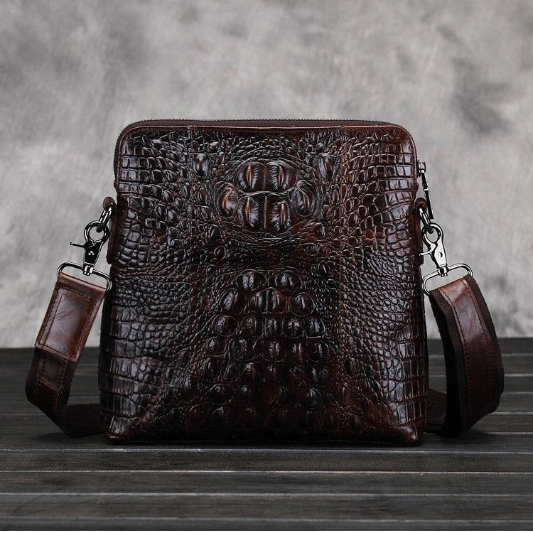 A durable, stylish leather shoulder bag with a vertical square design and multiple interior pockets for modern men's everyday use.