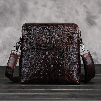 A durable, stylish leather shoulder bag with a vertical square design and multiple interior pockets for modern men's everyday use.