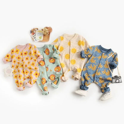 Adorable baby wearing a cartoon-printed long-sleeved romper, playing and exploring comfortably.