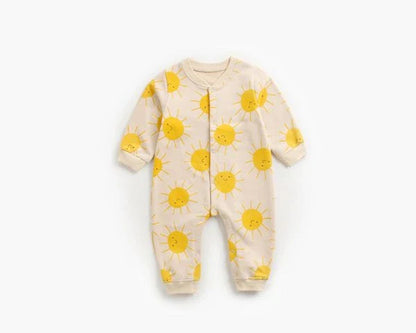 Adorable baby wearing a cartoon-printed long-sleeved romper, playing and exploring comfortably.