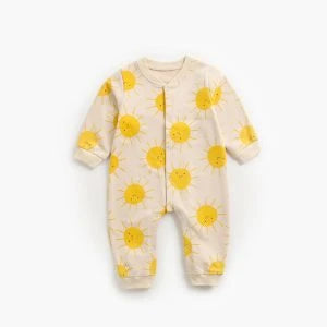 Adorable baby wearing a cartoon-printed long-sleeved romper, playing and exploring comfortably.