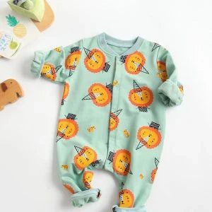 Adorable baby wearing a cartoon-printed long-sleeved romper, playing and exploring comfortably.
