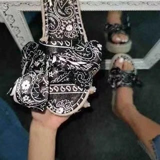 Pair of hemp straw bow slippers with satin material, available in blue, black, and pink colors