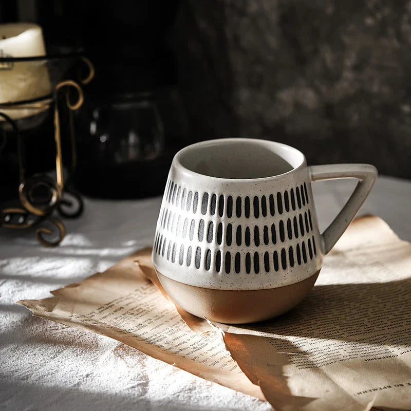 A hand-painted ceramic mug with a retro Nordic-inspired design, perfect for enjoying coffee, tea, or other hot beverages.