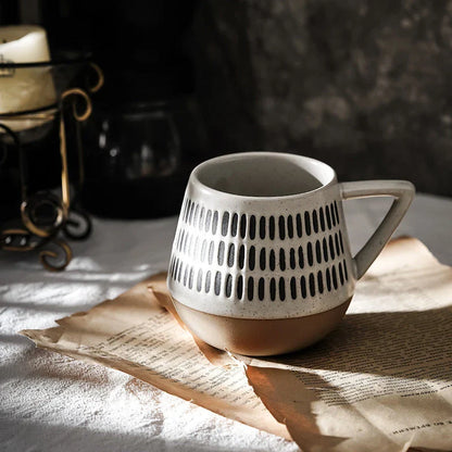 A hand-painted ceramic mug with a retro Nordic-inspired design, perfect for enjoying coffee, tea, or other hot beverages.