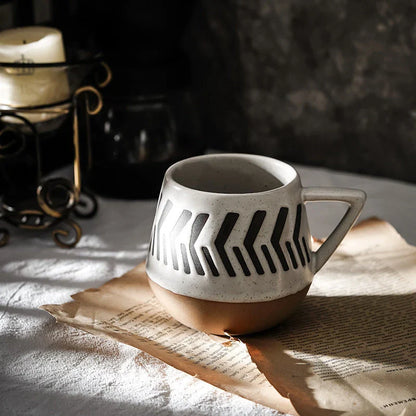 A hand-painted ceramic mug with a retro Nordic-inspired design, perfect for enjoying coffee, tea, or other hot beverages.