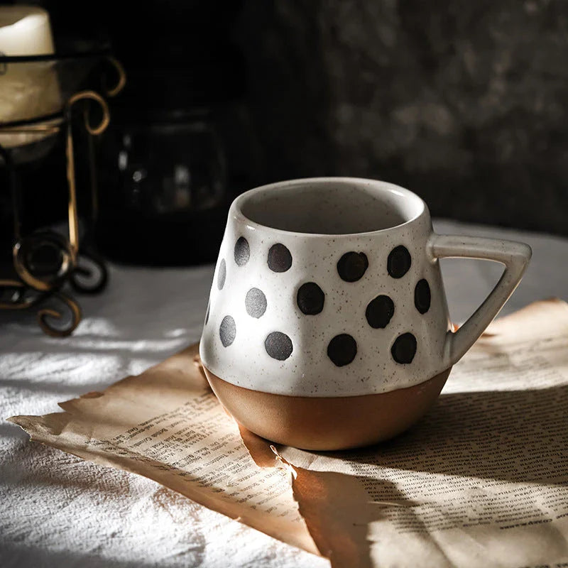 A hand-painted ceramic mug with a retro Nordic-inspired design, perfect for enjoying coffee, tea, or other hot beverages.