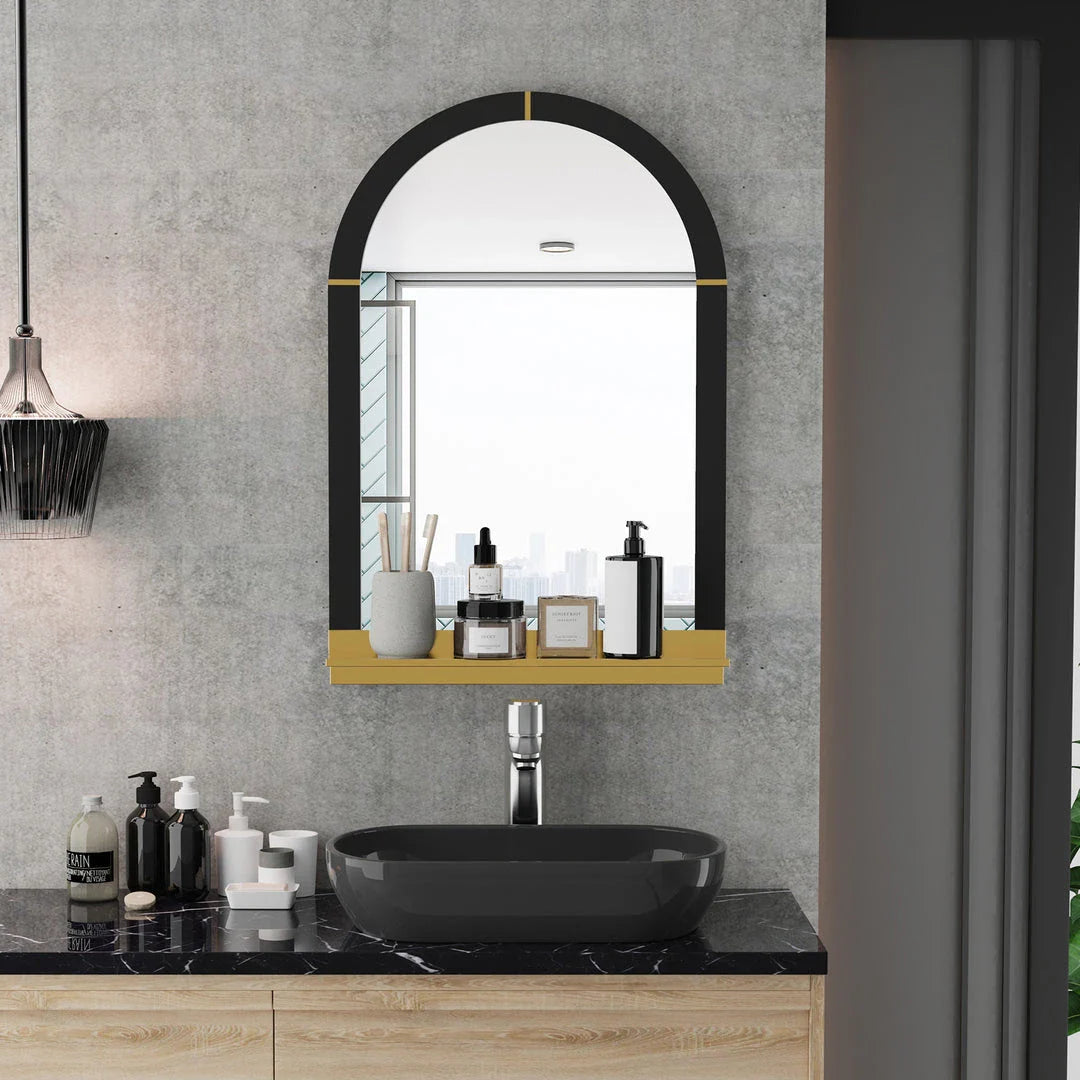 Arched black and gold wall mirror with decorative shelf, perfect for enhancing the style and functionality of any room.