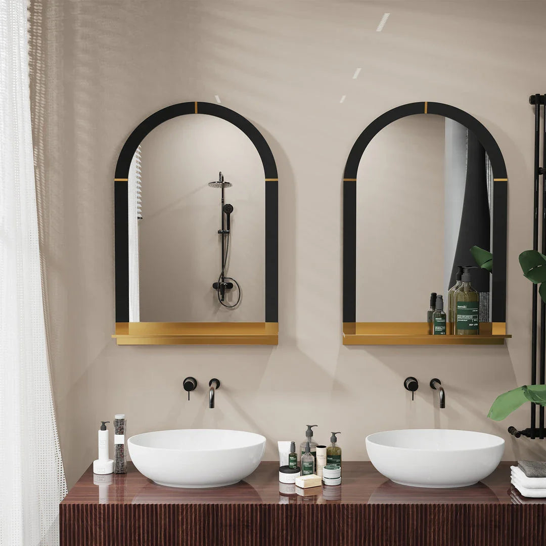 Arched black and gold wall mirror with decorative shelf, perfect for enhancing the style and functionality of any room.